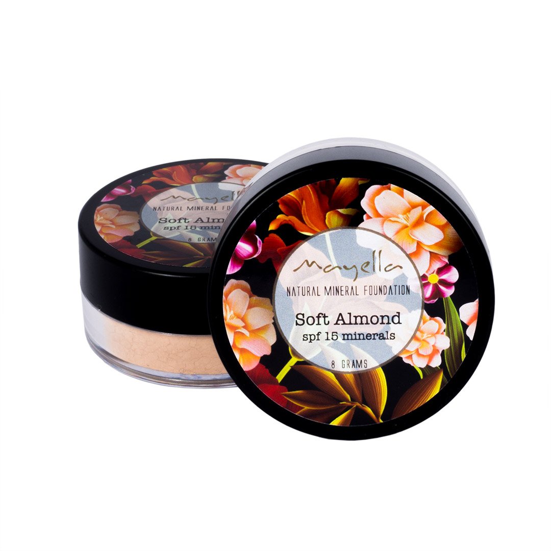 two round containers of loose mineral powder foundation, one sitting flat and one up on the rounded edge to show the label