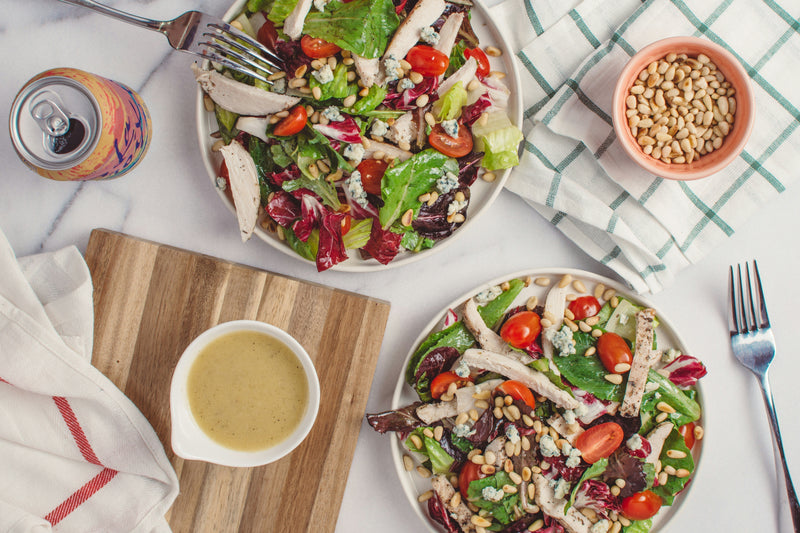 Living Keto, stay nourished with Mayella Organic whole foods for a healthy lifestyle. A simple delicious meal of nuts, salad vegetables and a oil dressing.