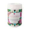 tub of beauty and brains tisane with a pink, green and blue floral design on a white background