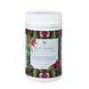 tub of skin tonic tisane with a black, green and red floral design on a white background